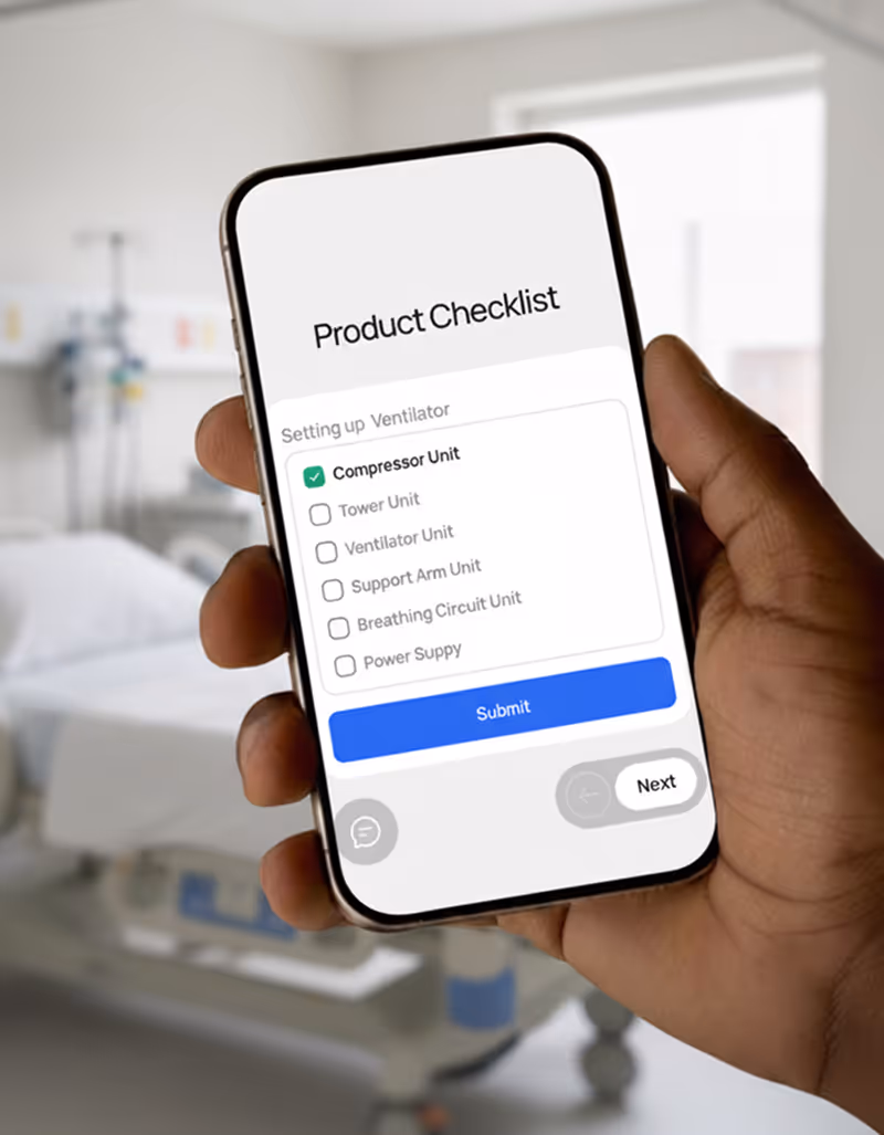 Hand holding smartphone displaying a product checklist for setting up a ventilator with 'Compressor Unit' checked and options to submit or go next.