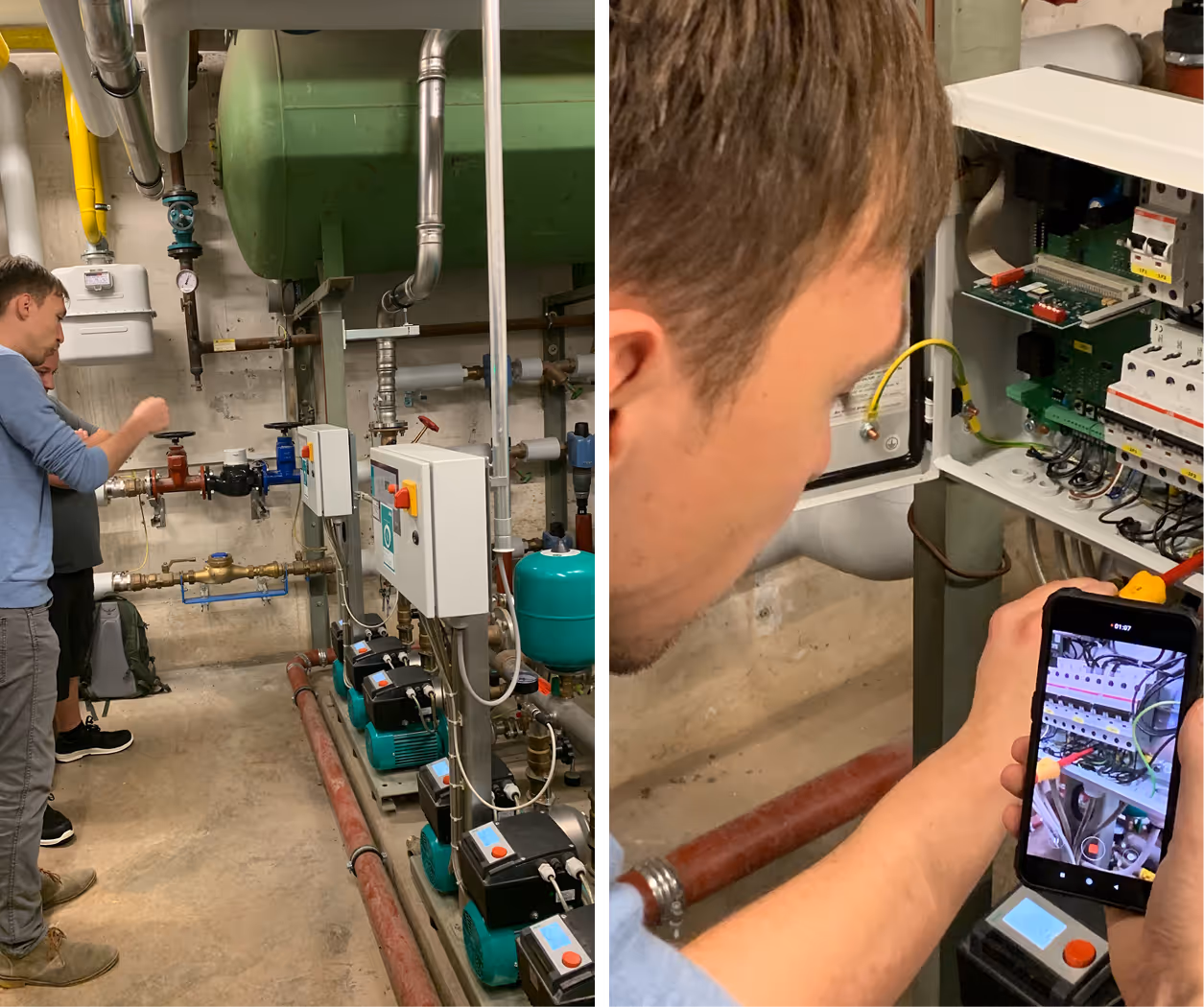 Two technicians working on industrial water pumps and electrical control panels, one using a smartphone to inspect wiring.